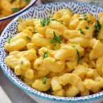 Small bowl with creamy vegan butternut squash mac and cheese.
