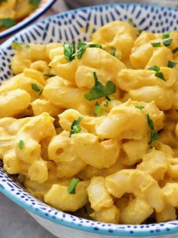 Small bowl with creamy vegan butternut squash mac and cheese.