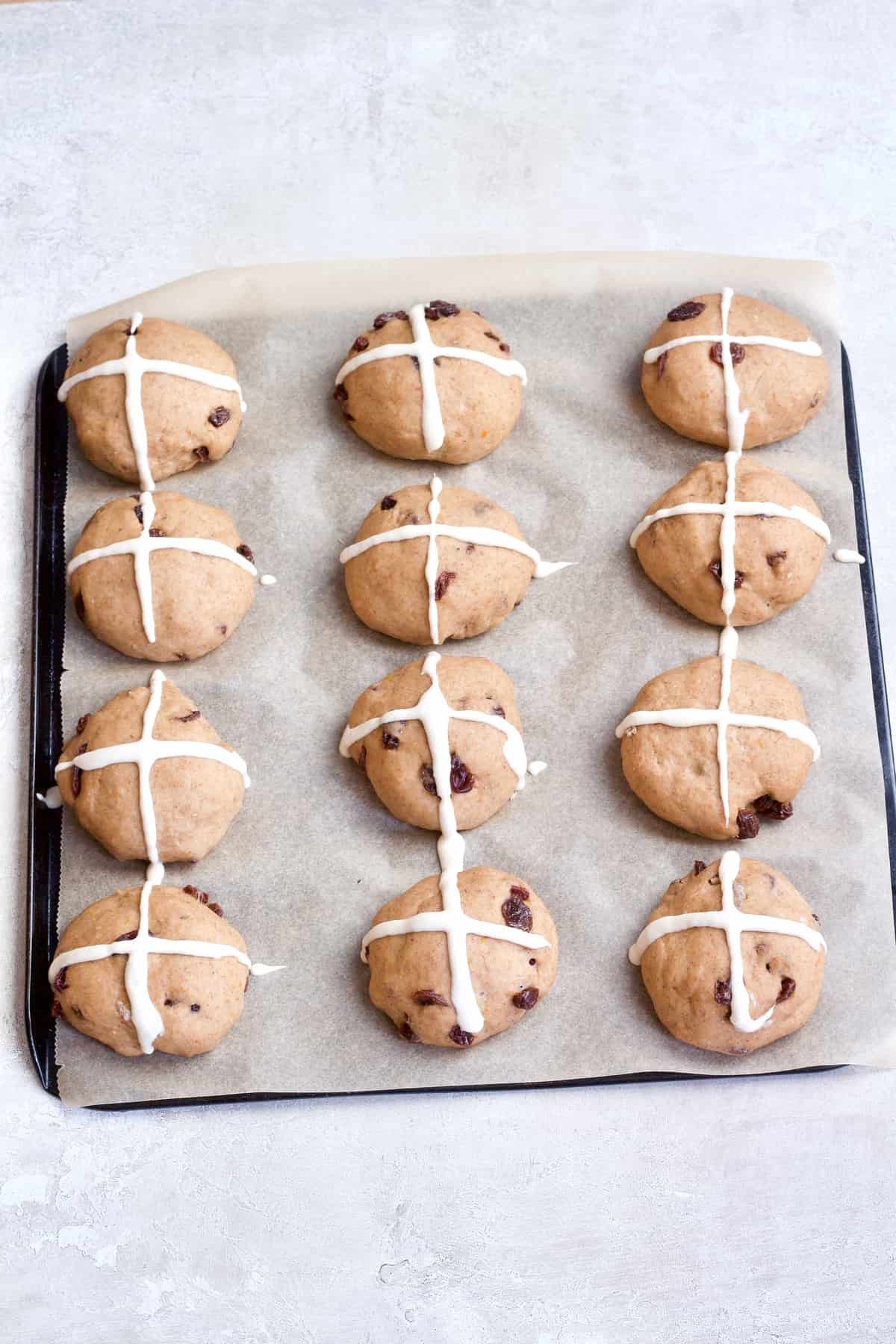 Buns with crosses on ready for the oven.
