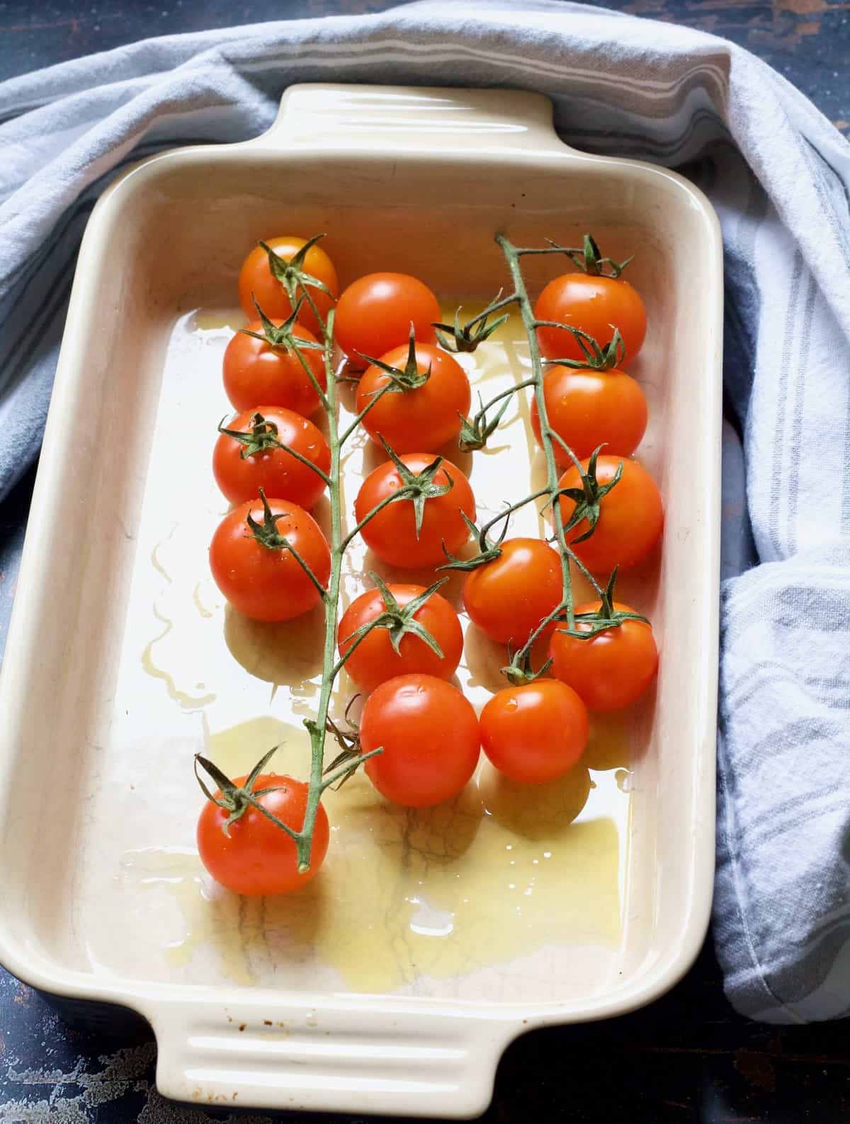 Cherry tomatoes in a baking dish.