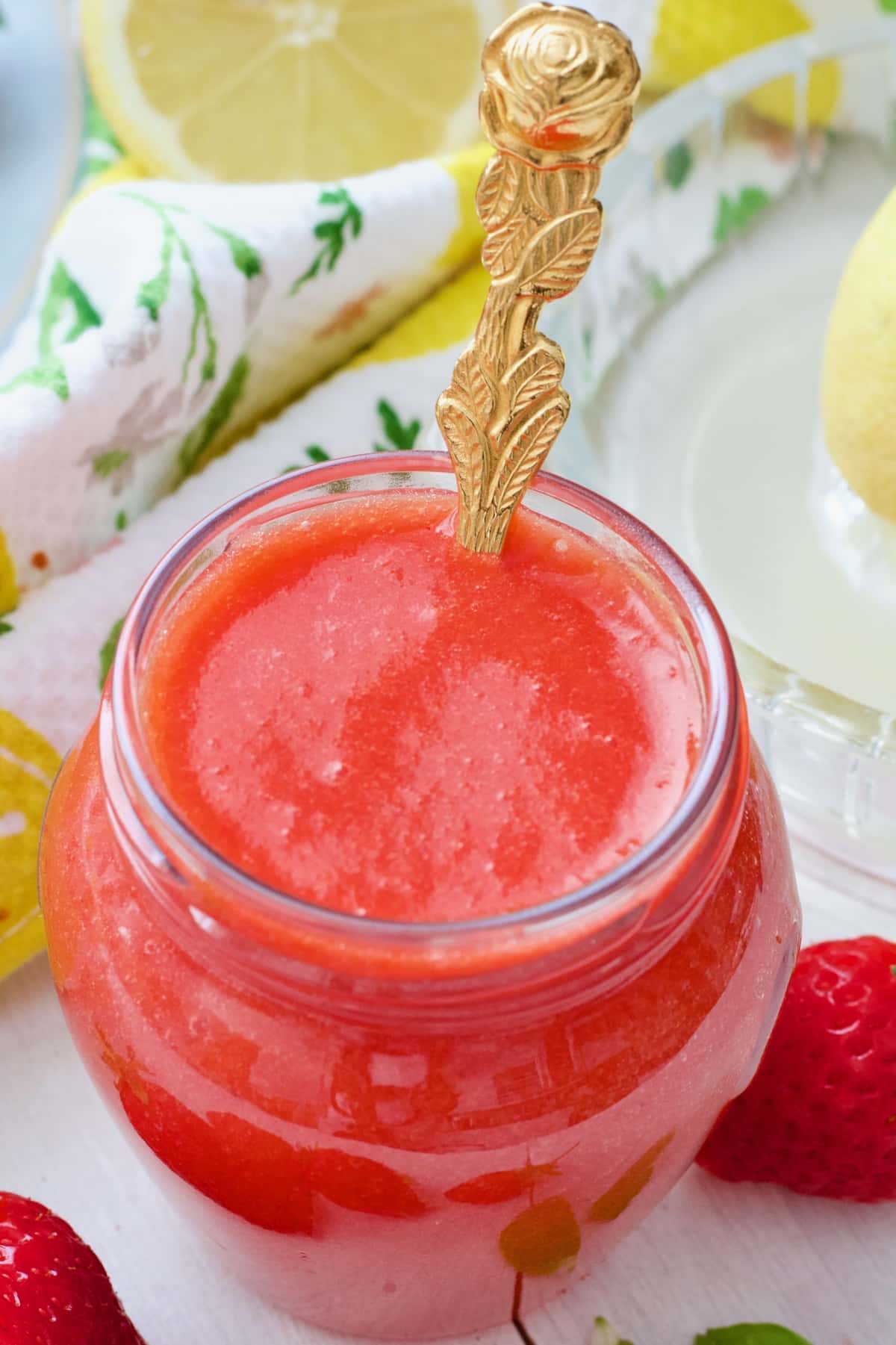 Close up of jar with strawberry coulis.