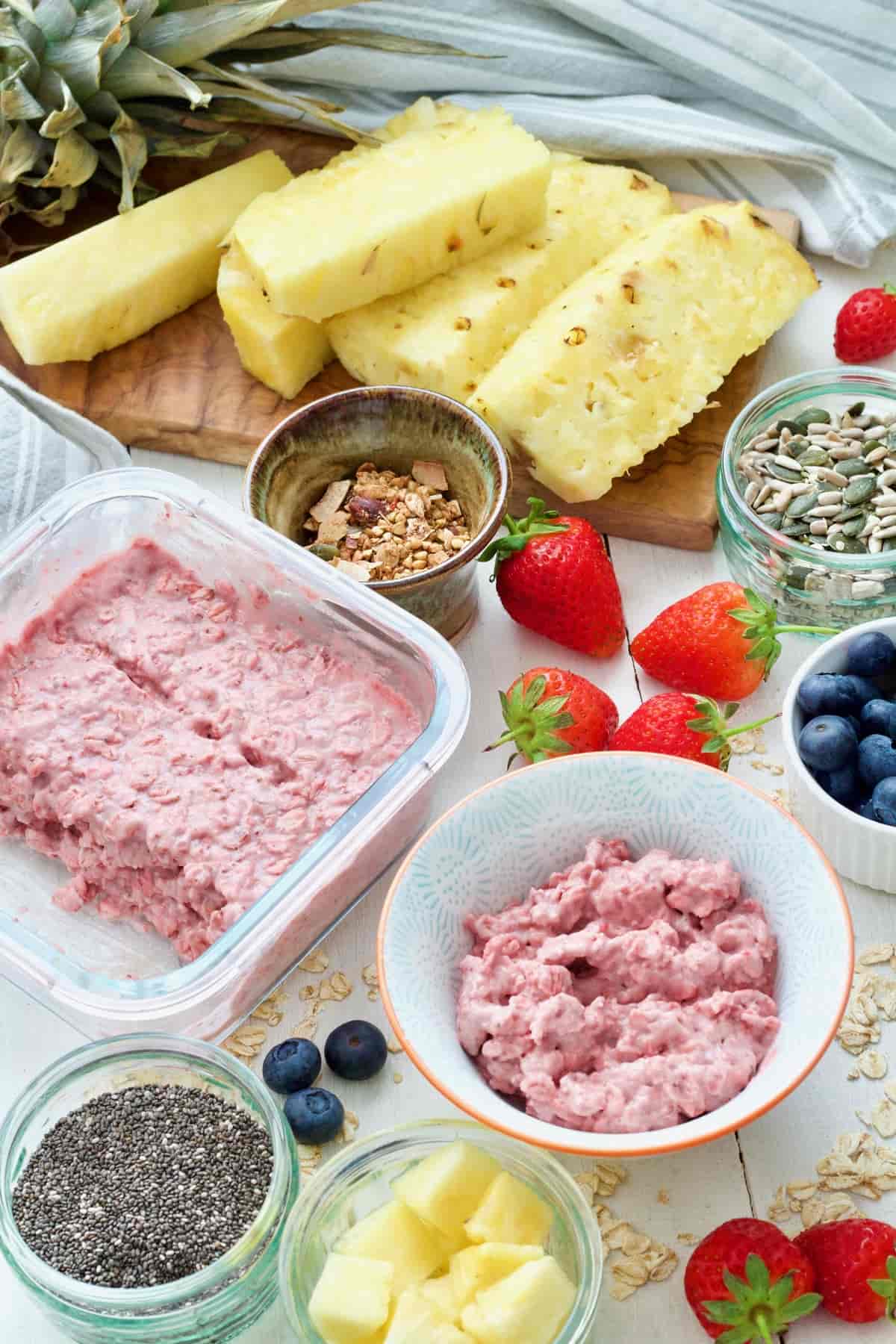Strawberry overnight oats, toppings & variety of fruits.