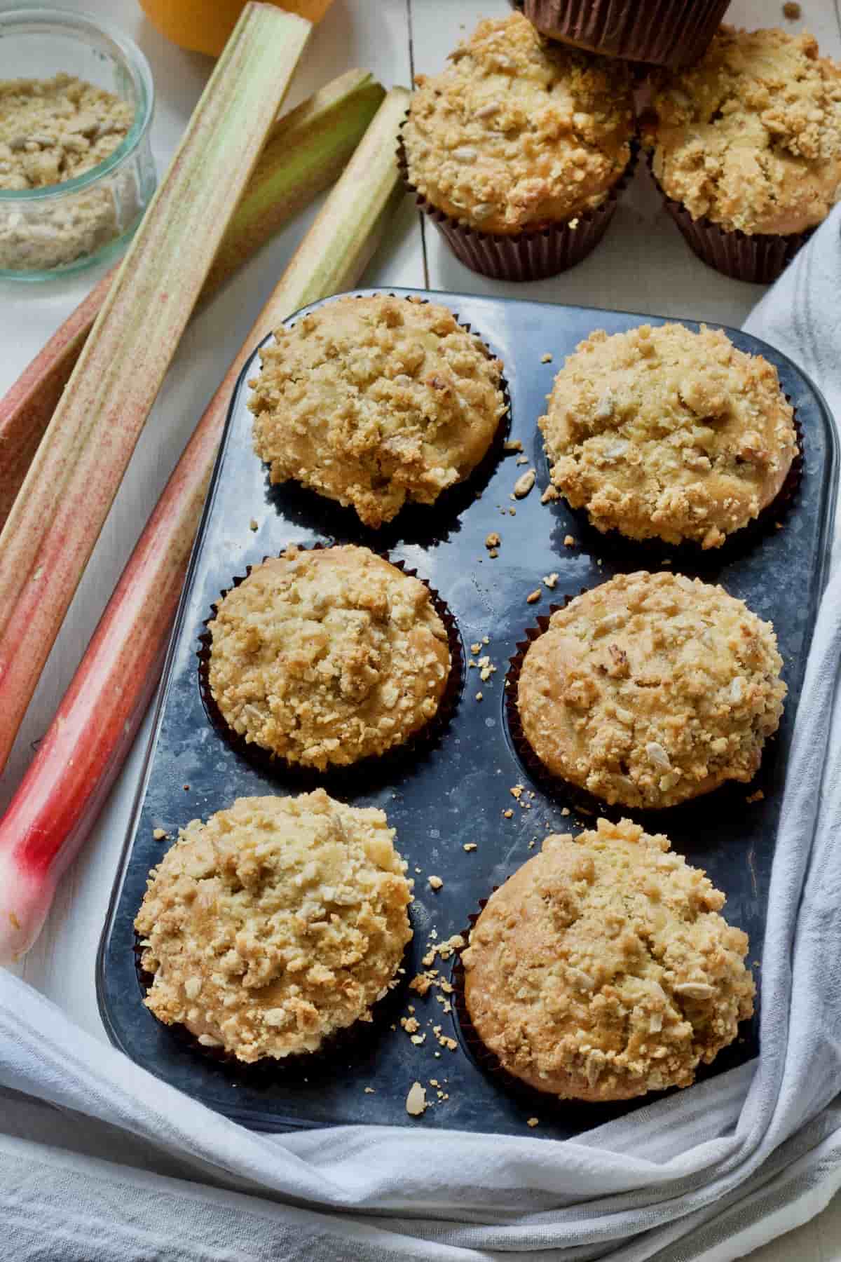 Baked rhubarb muffins still in a muffin tin.