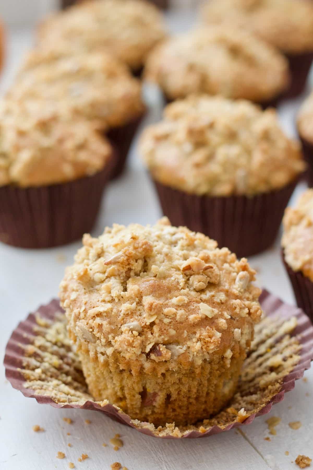 Close up of a rhubarb muffin with crumble topping.