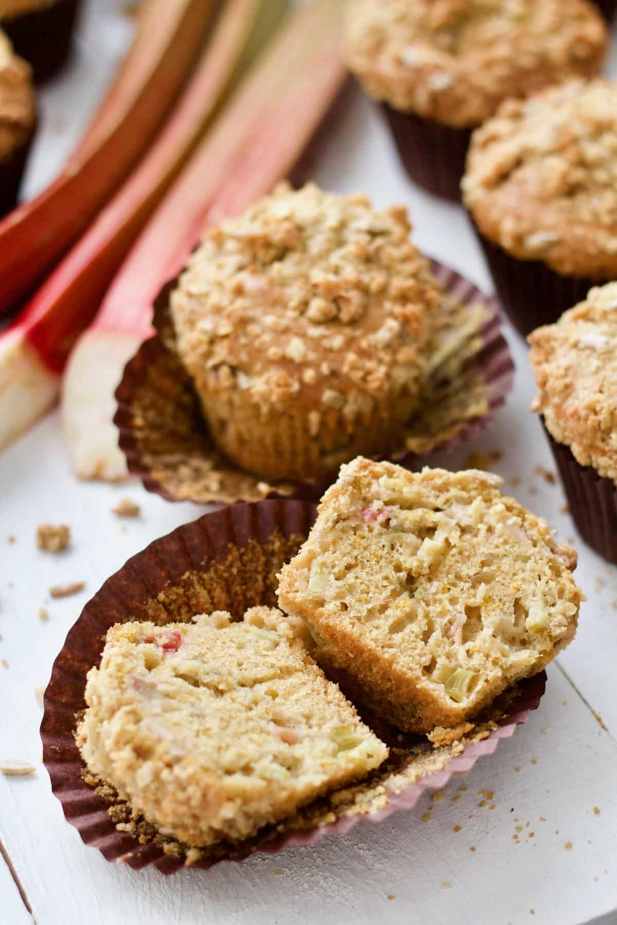 Muffin cut in half laying in paper case.