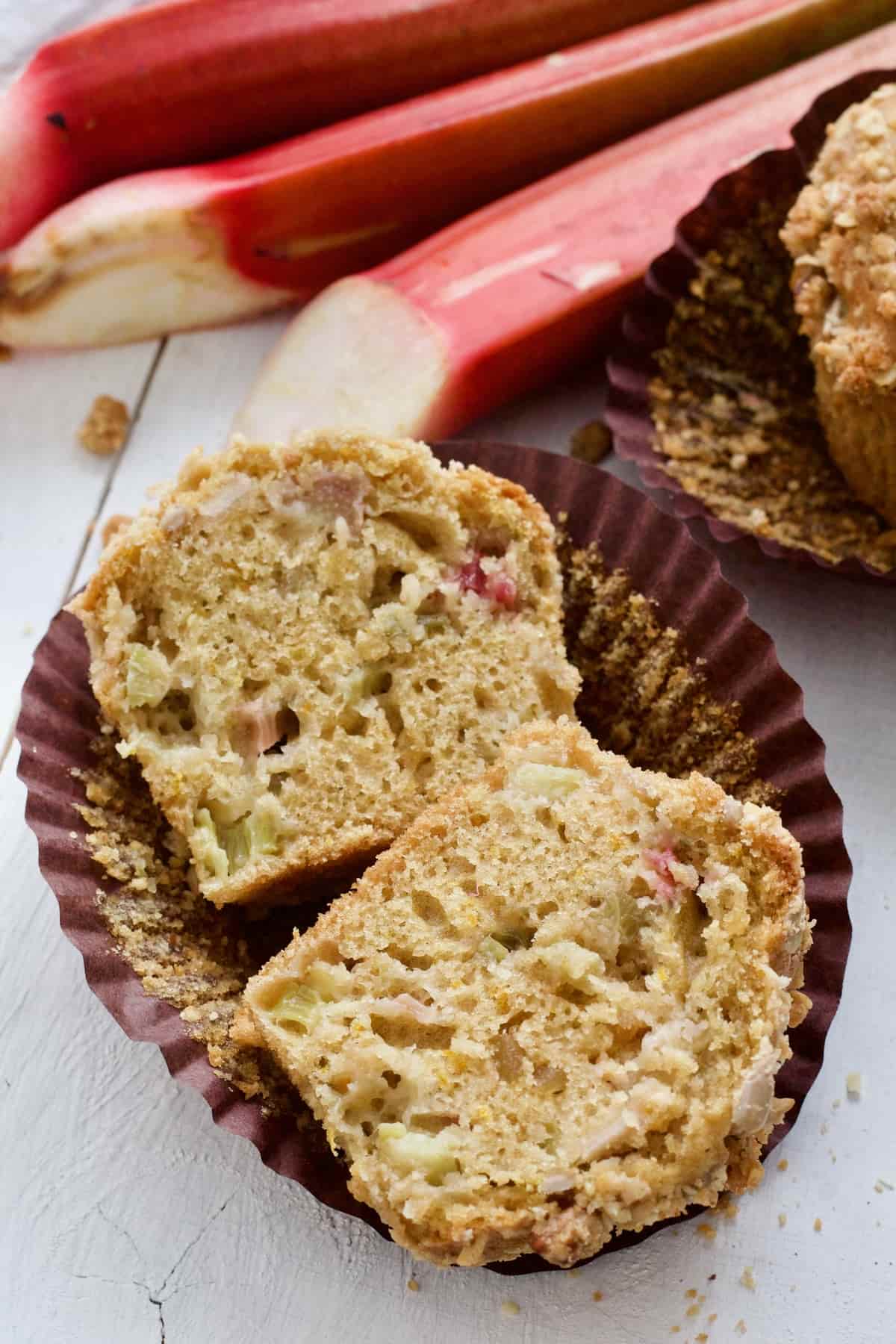 Close up of halved muffin in paper case.