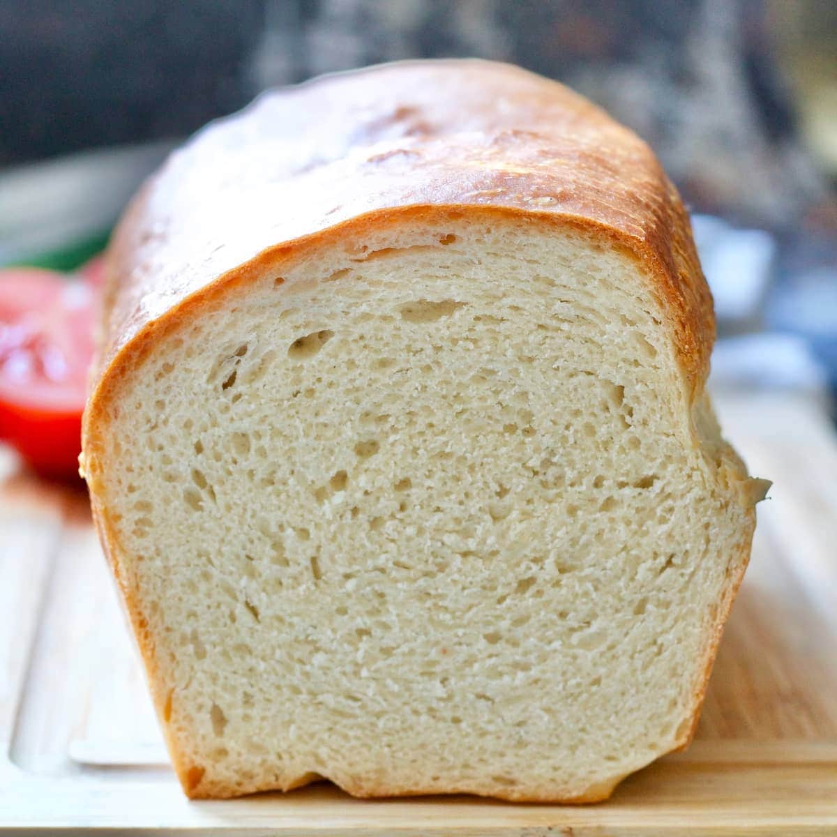 Close up of cut white bread loaf showing off its crumb.