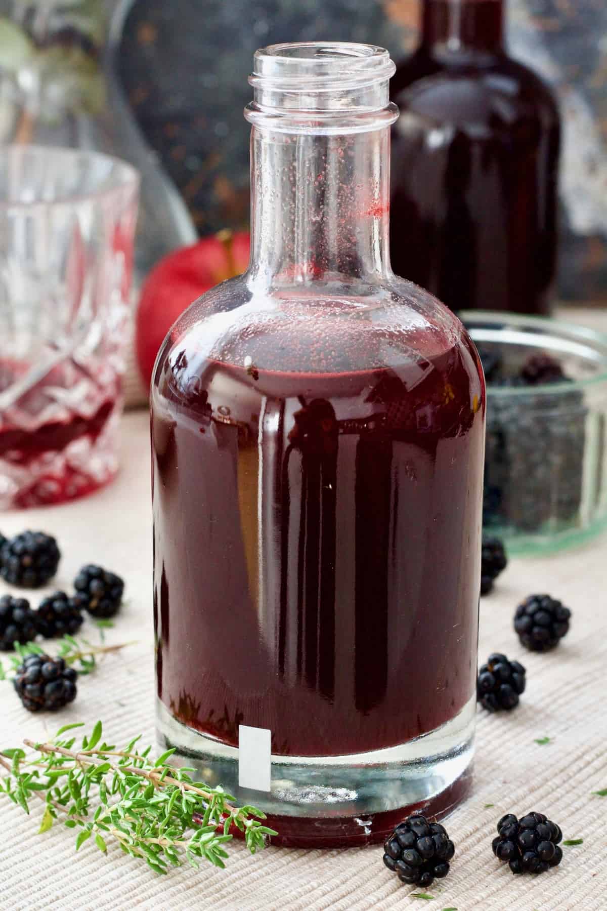 Close up of bottle with blackberry vinegar.