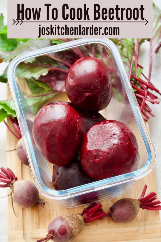 Cooked and peeled beets in a glass container.