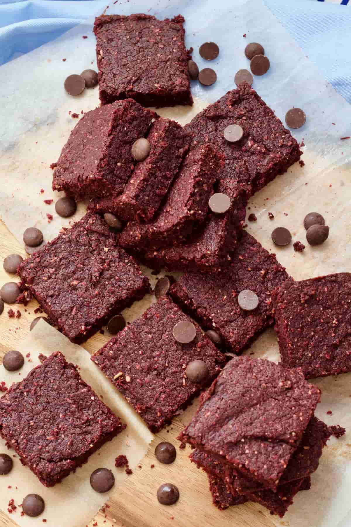 Squares of beetroot brownies with chocolate chips sprinkled over.