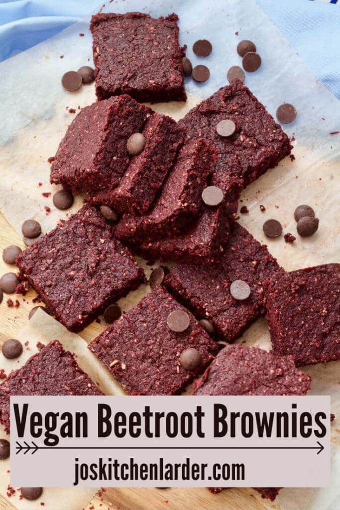 Squares of beetroot brownies with chocolate chips sprinkled over.