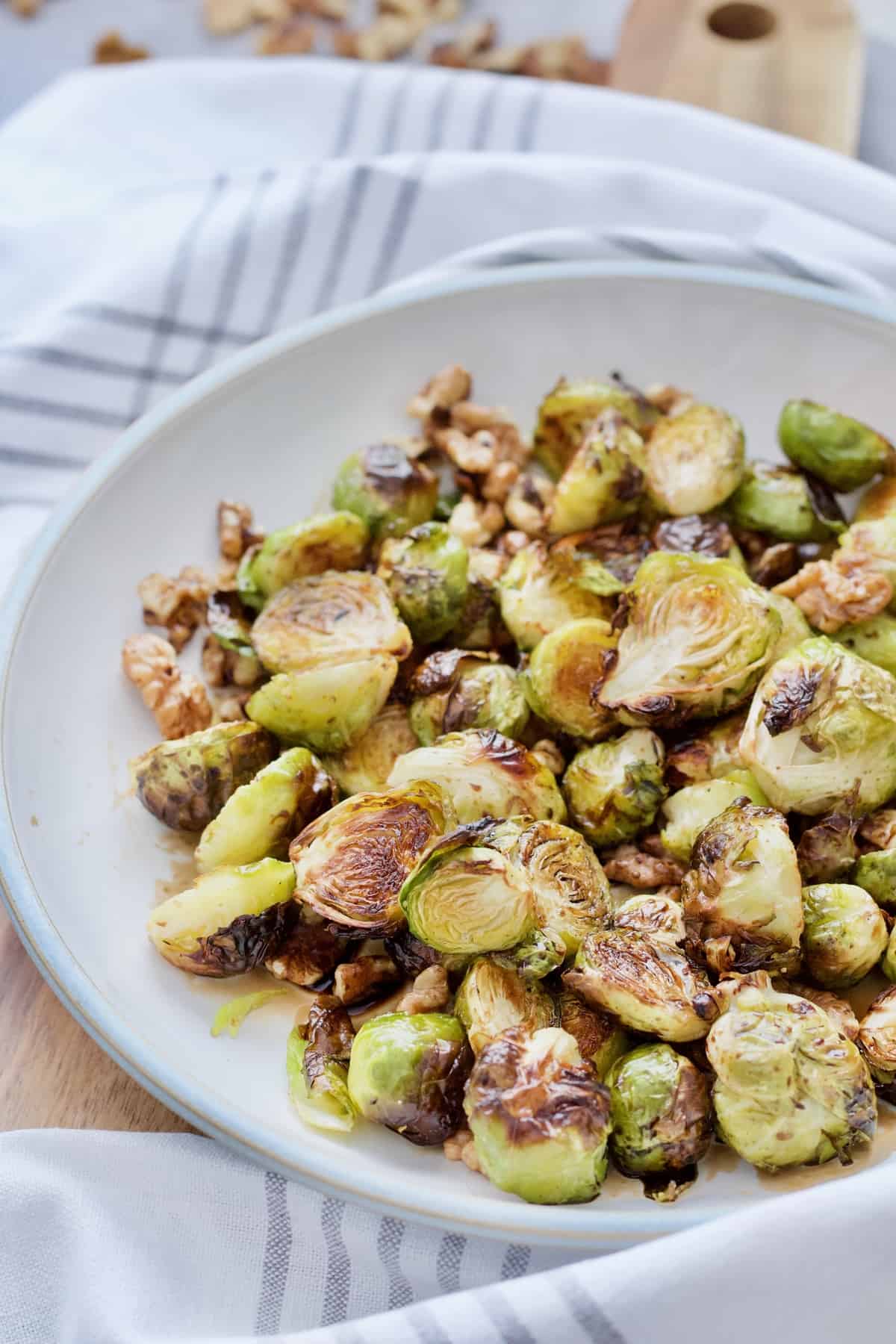 Angle view of a bowl with roasted Brussels sprouts.