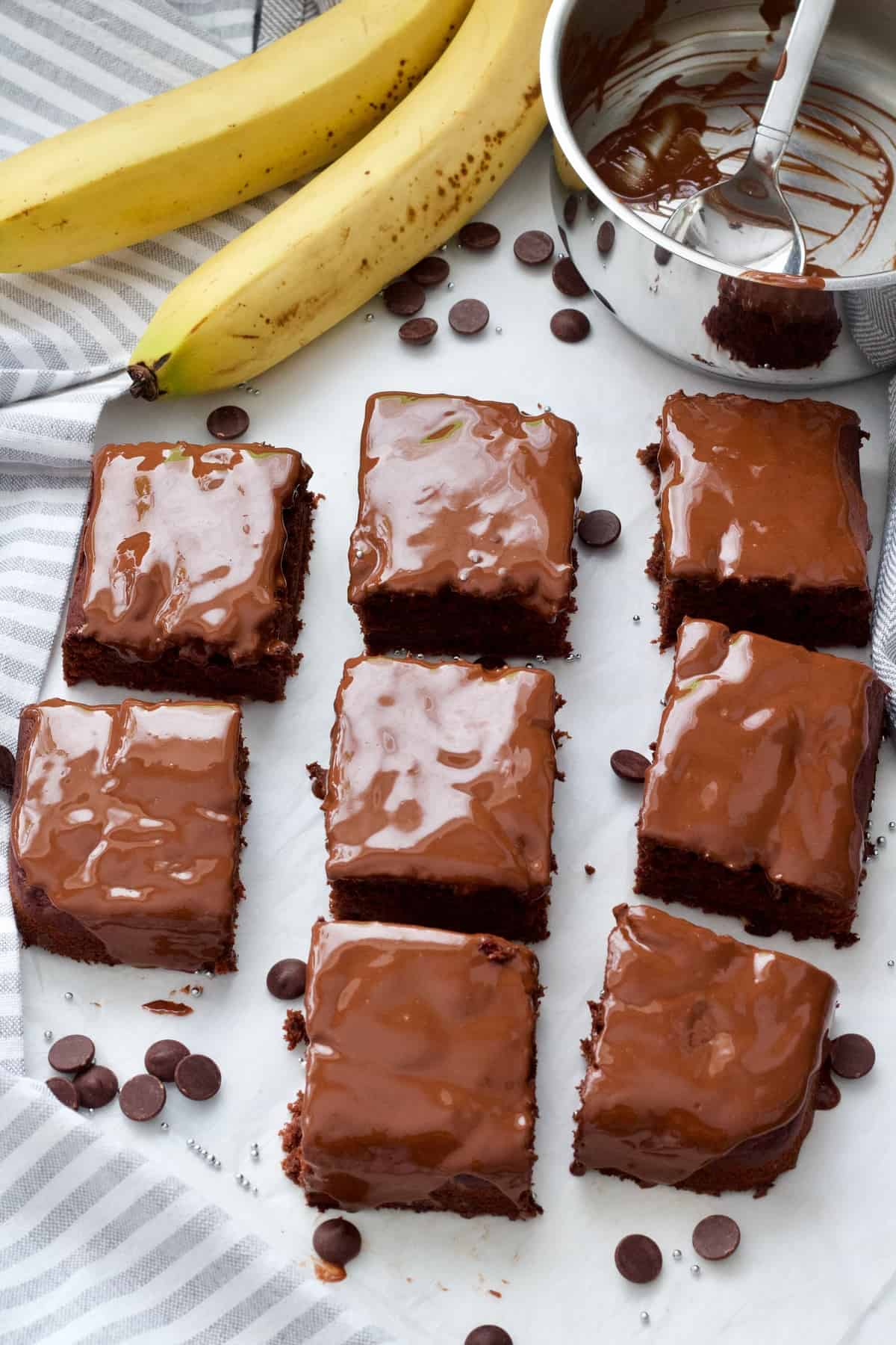 8 portions of cake with ganache, chocolate chips, bananas.