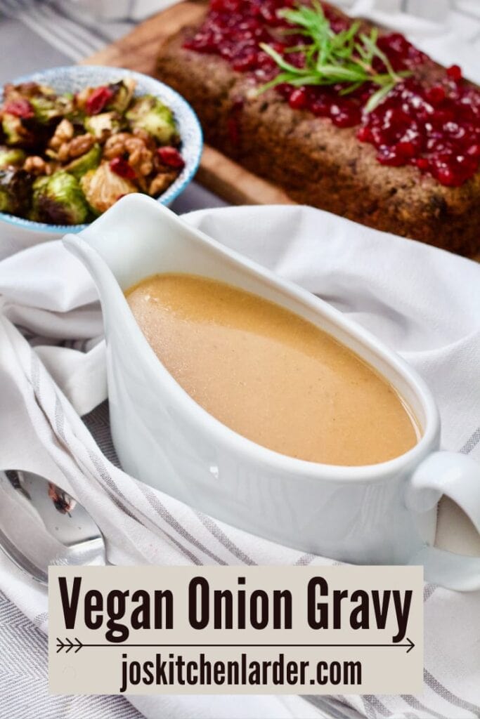 Vegan onion gravy in a gravy boat from the side.