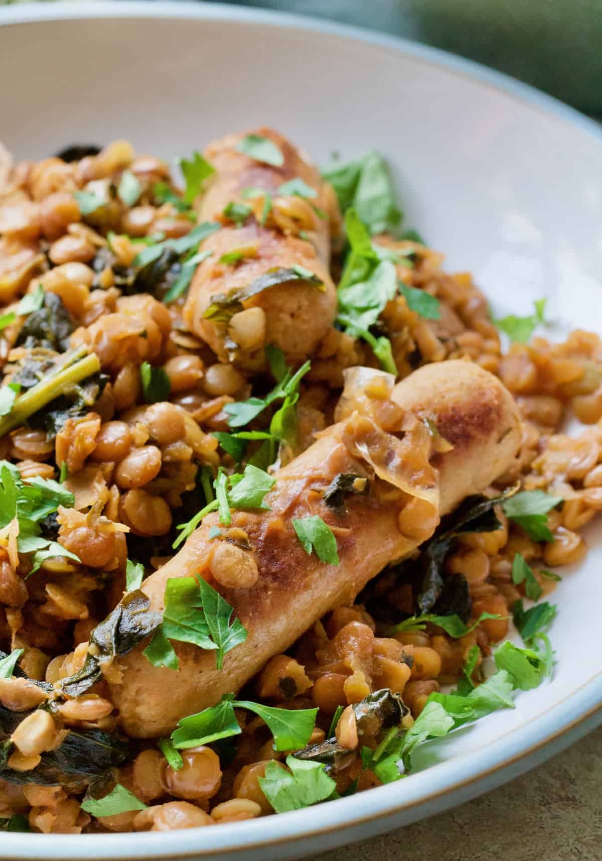 Close up of sausage in a vegan sausage casserole.