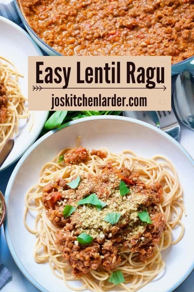 Bowl of vegan spaghetti bolognese with vegan parmesan and basil.