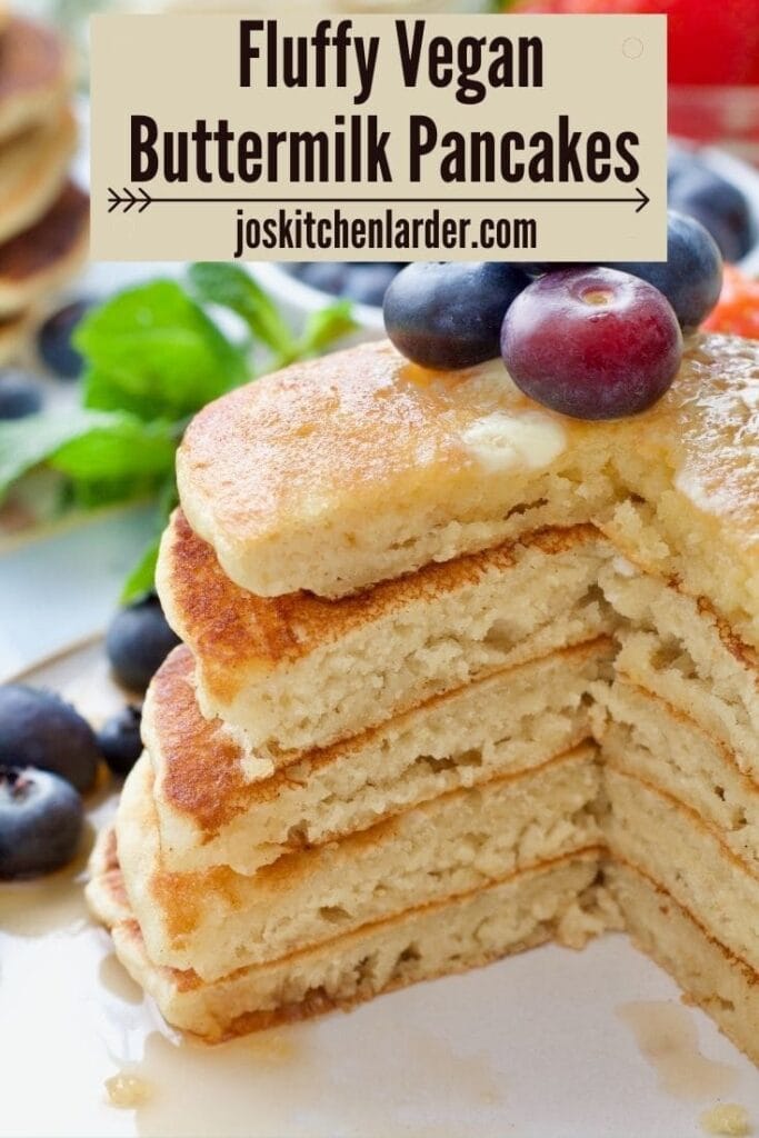 Stack of vegan pancakes with section cut out.