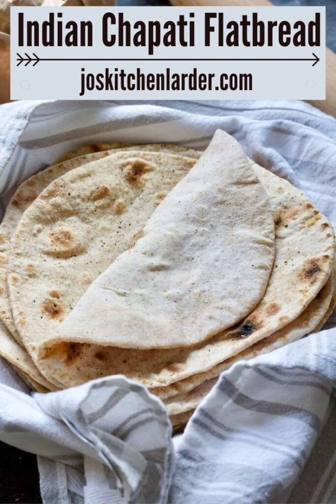 Pile of chapatis with top one folded over.