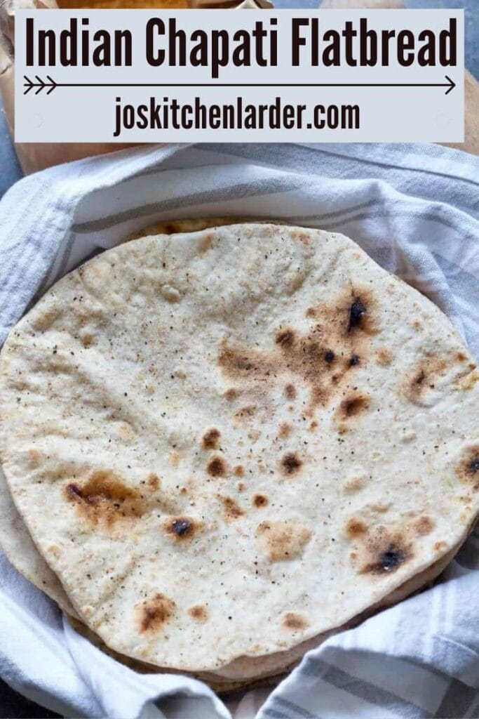 Cooked round flatbreads in a towel.