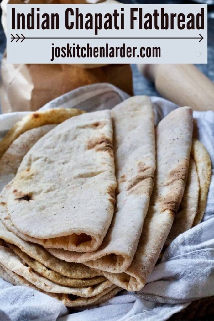 Folded flatbreads resting on a towel.