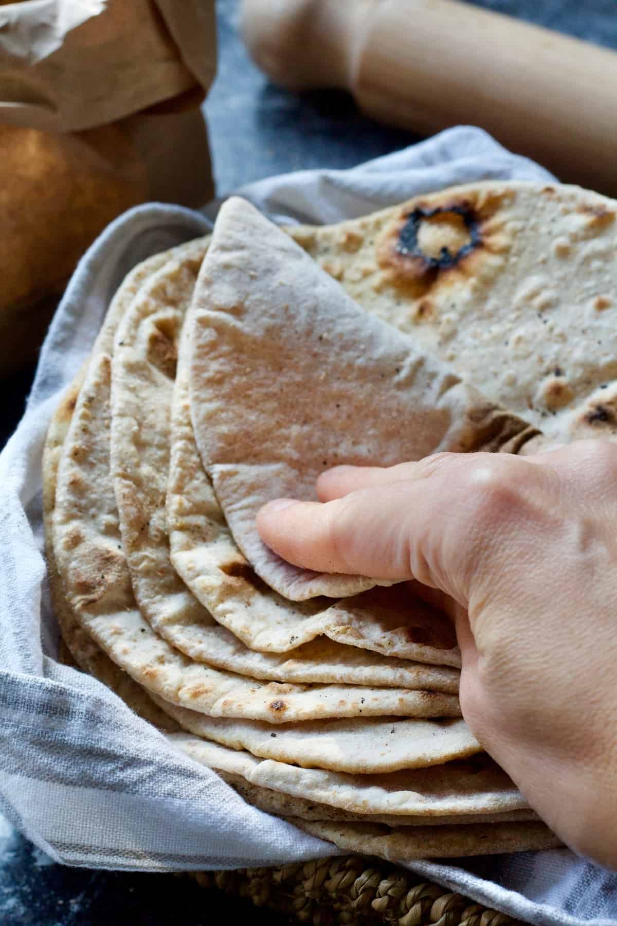 Hand folding soft chapati.