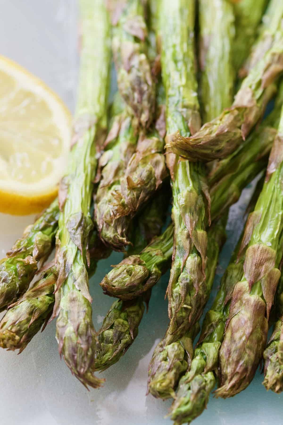 Air fried asparagus spears close up.