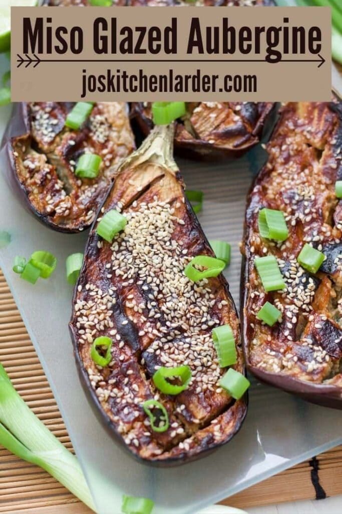 Close up of miso aubergine with sesame seeds and spring onions.