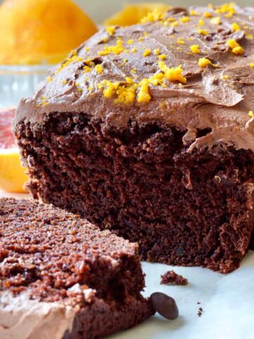 Close up of chocolate orange cake and slice.