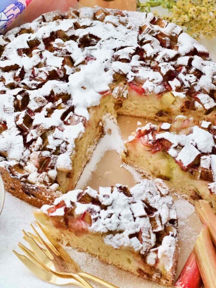 Easy rhubarb cake with two slices cut and ready to be served.