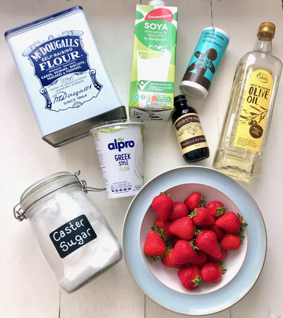 Ingredients for making strawberry yogurt cake.