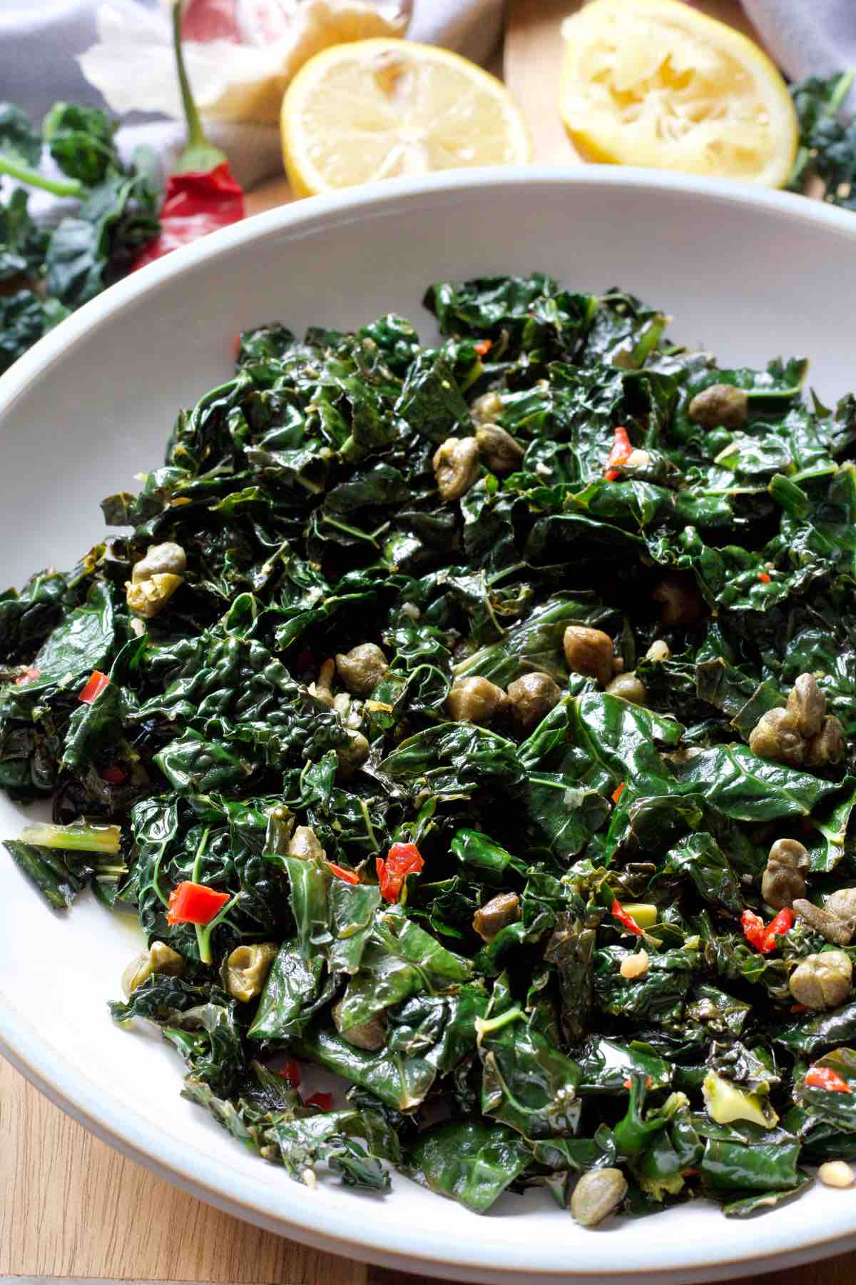 Serving bowl with cavolo nero with chilli, garlic and crispy capers.