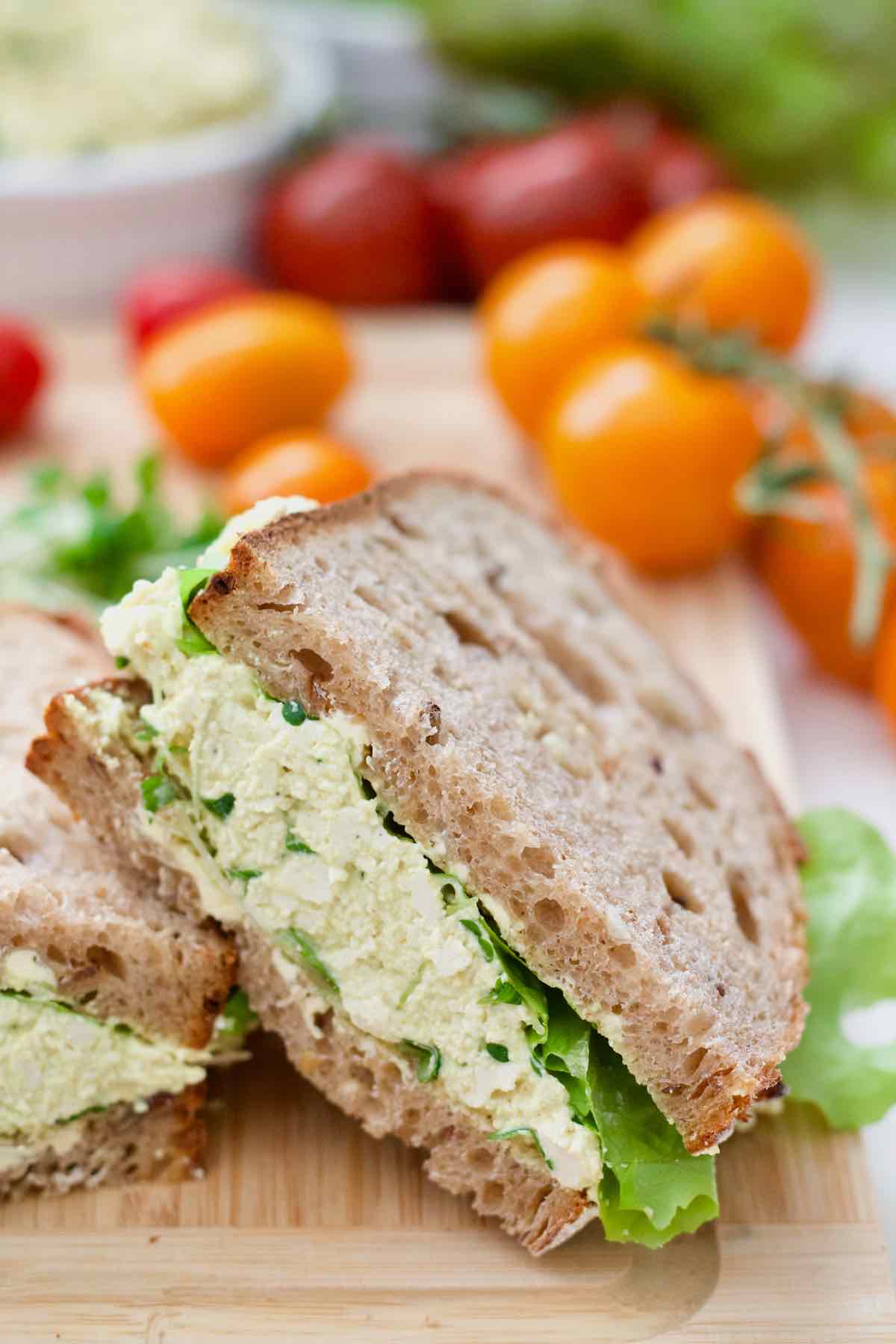 Vegan egg salad sandwich angle close up.