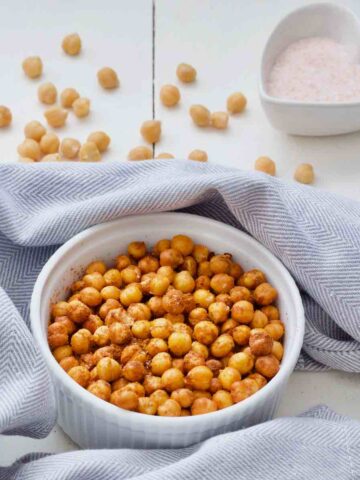 Chickpeas in a bowl wrapped in tea towel.