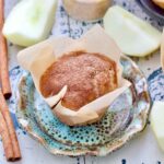Close up of apple cinnamon muffin wrapped in paper