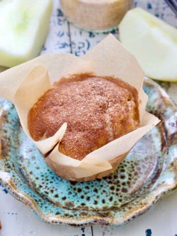 Close up of apple cinnamon muffin wrapped in paper