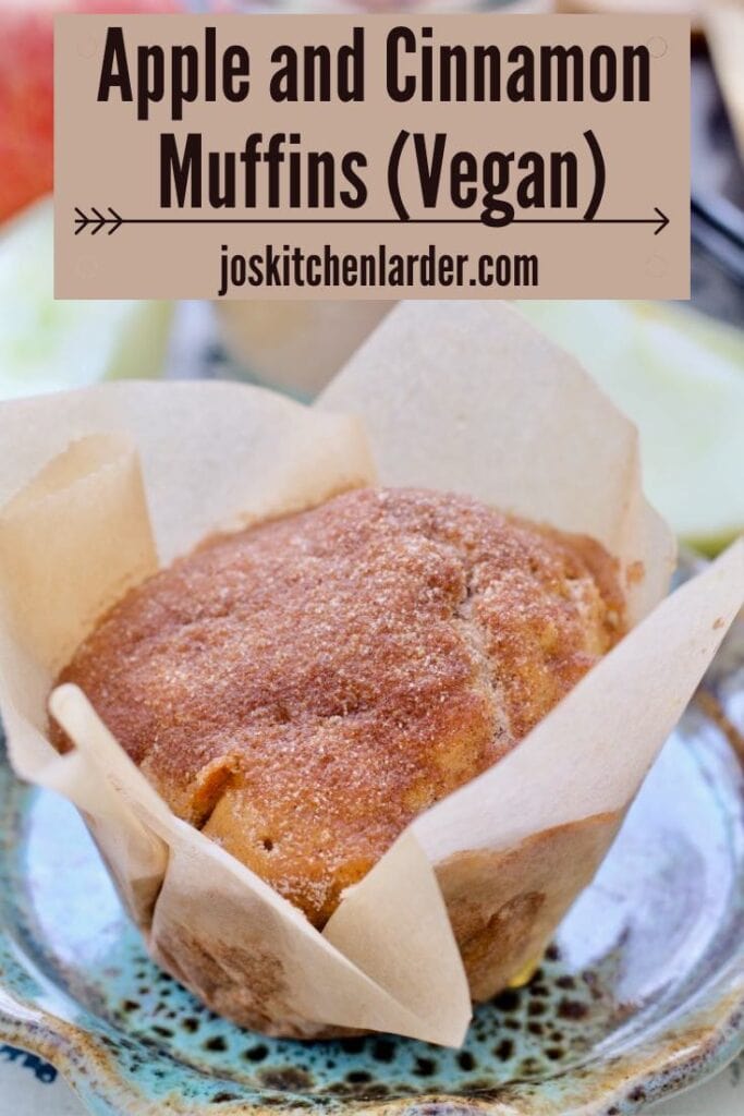 Apple cinnamon muffin wrapped in paper.