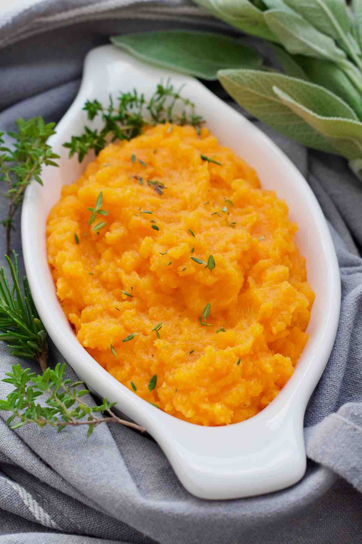 Carrot and swede mash in a serving dish.