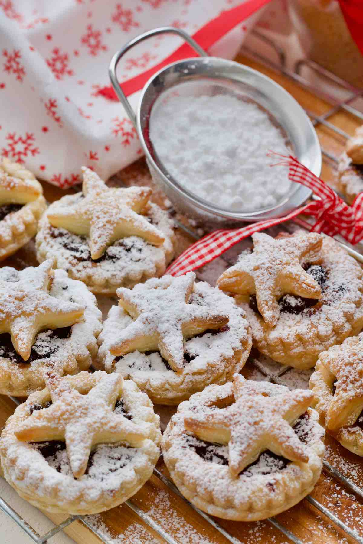 Mince pies and sieve with icing sugar.