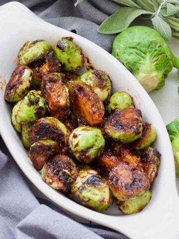 Oval dish with Asian Brussels sprouts.