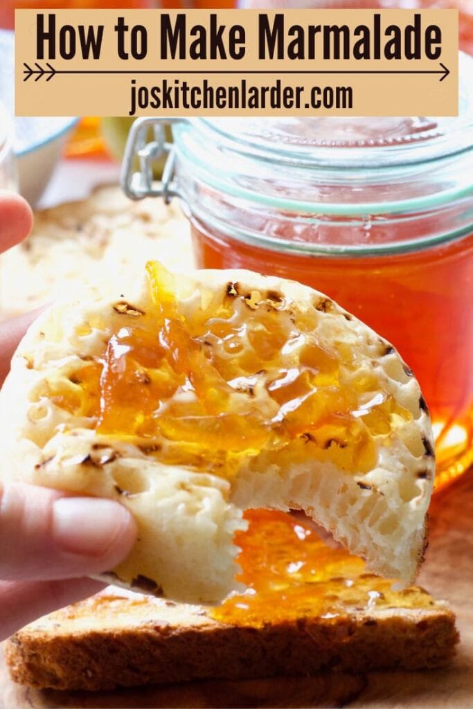 Crumpet with marmalade with bite taken out of it.