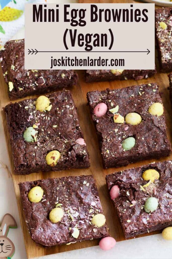 Mini egg brownie squares on a board.