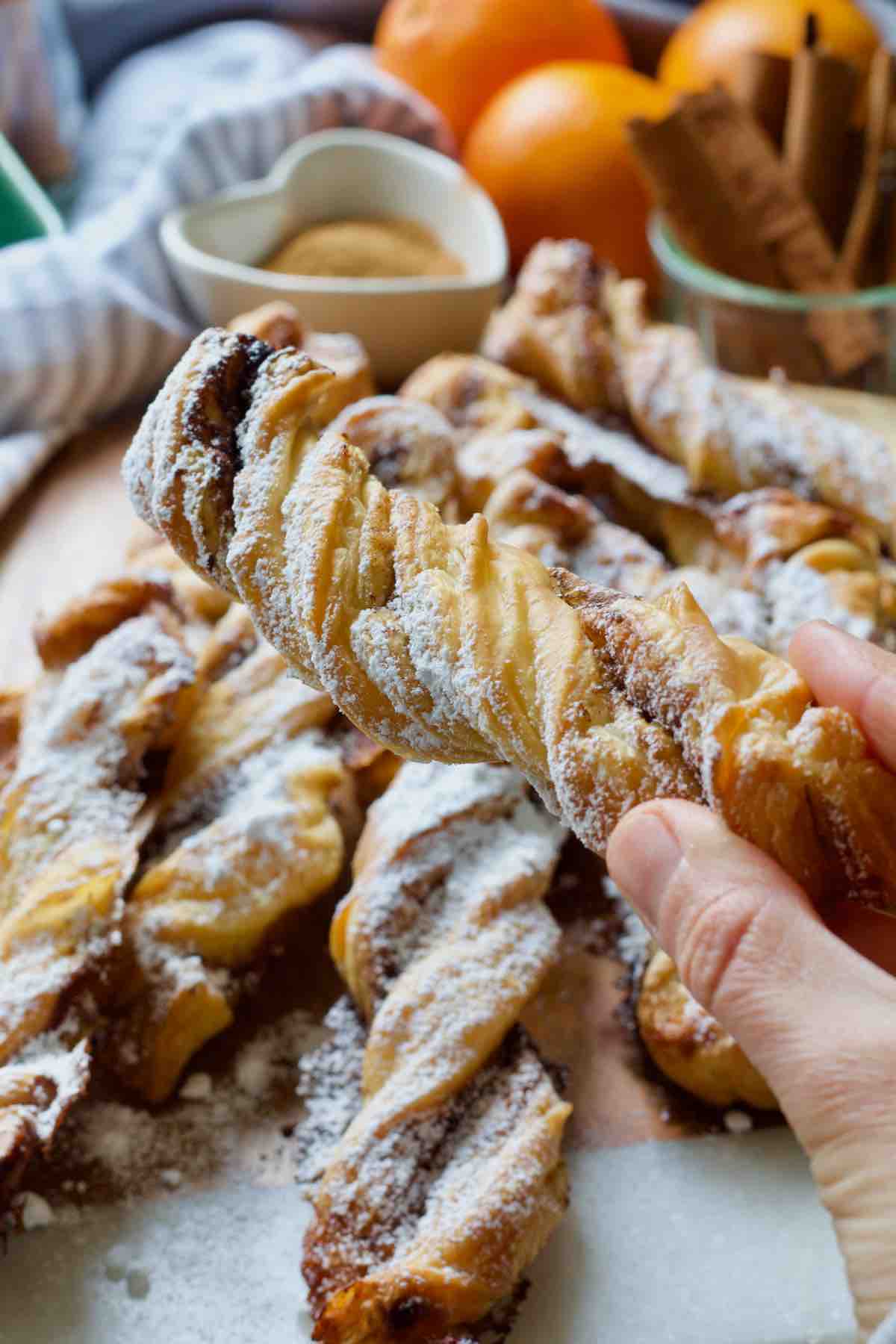 Hand holding cinnamon twist.