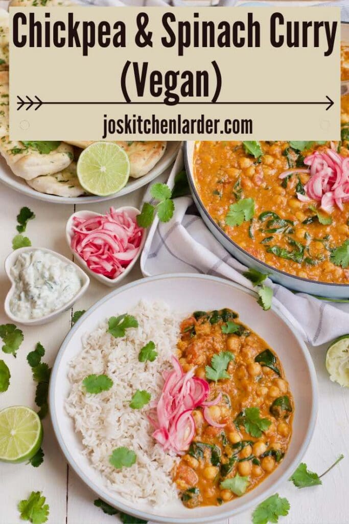 Chickpea and spinach curry spread with naan breads & bowl with curry and rice.