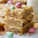 Close up of a stack of three mini egg blondies.