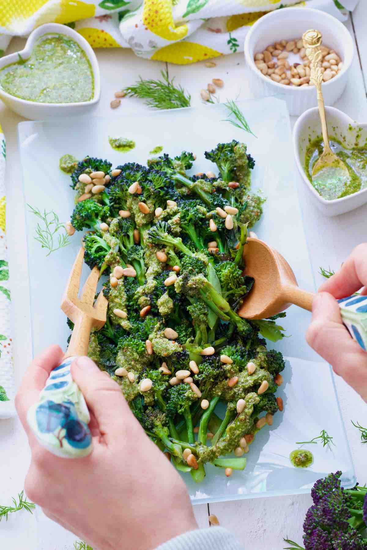 PSB topped with salsa verde and pine nuts being served.