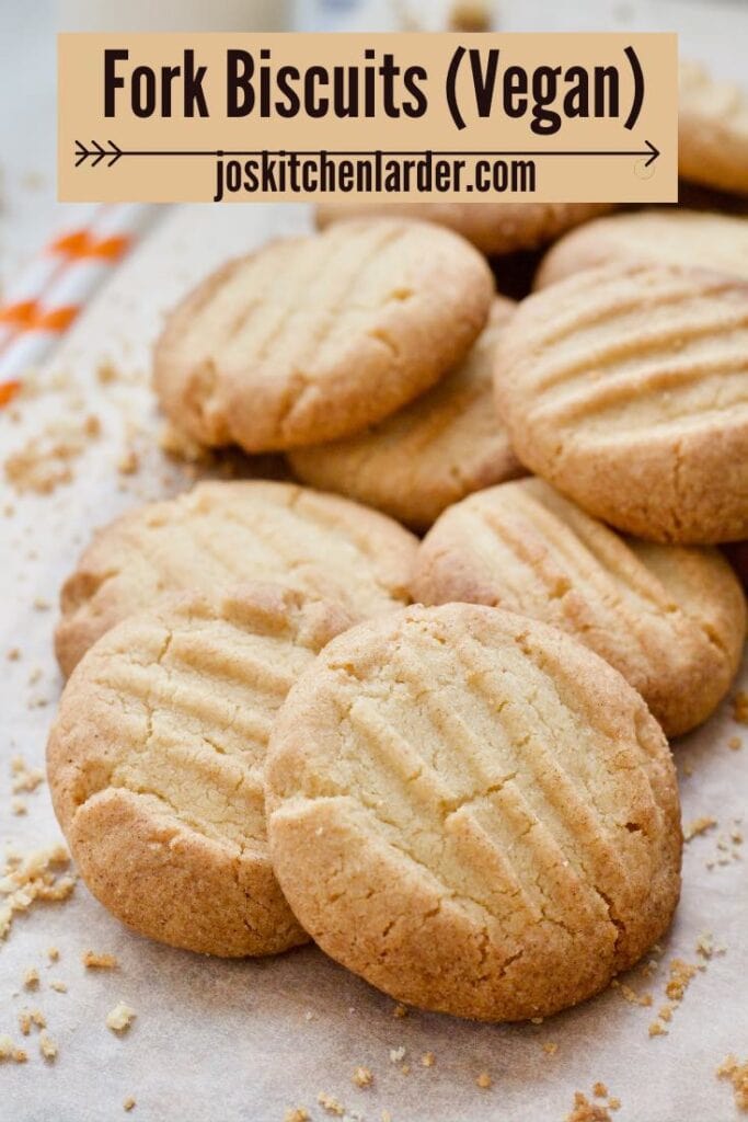 Pile of fork biscuits with crumbs around.