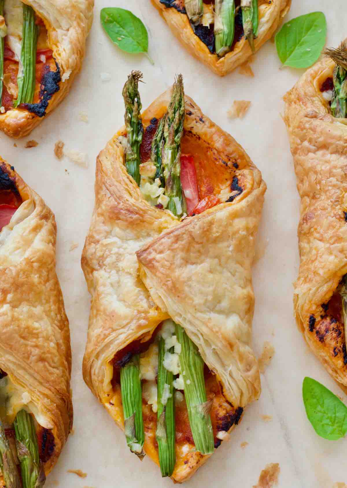 Close up of baked asparagus puff pastry parcel.