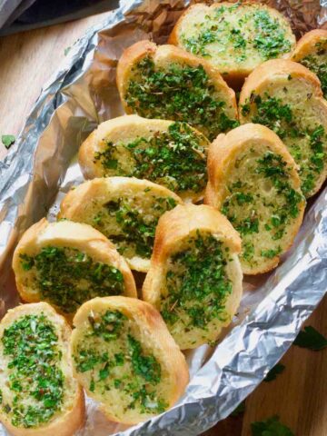 Close up of vegan garlic bread slices after baking.