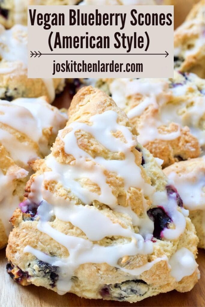 Close up of a blueberry scone with lemon drizzle.