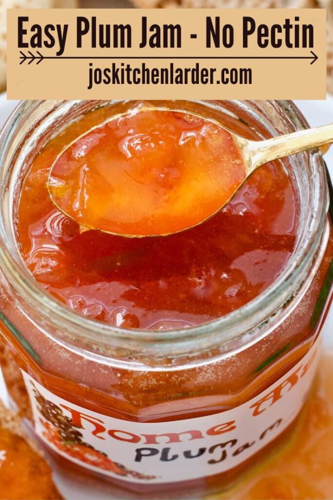 Spoon with jam over open jam jar.